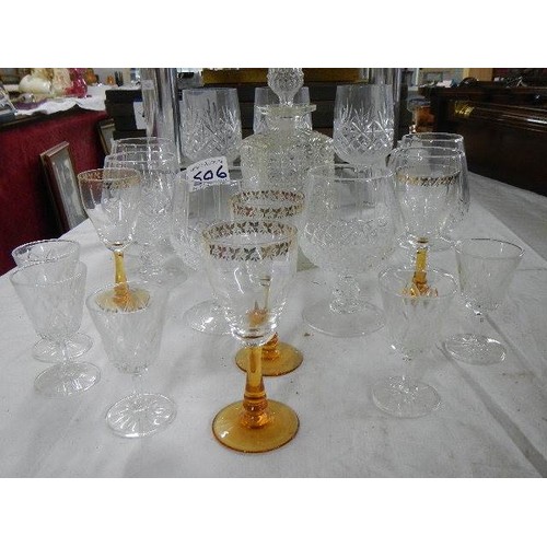 506 - A glass decanter, 6 cut glass drinking glasses and other glasses.