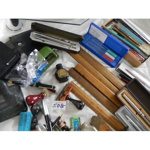 508 - A mixed lot of office items including hole punches, rulers etc.,