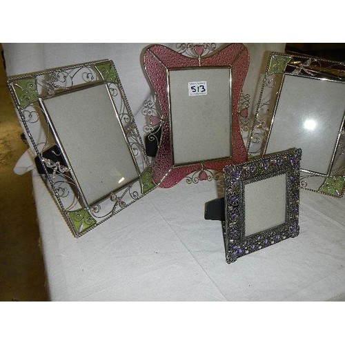 513 - Four good glass and metal photograph frames.