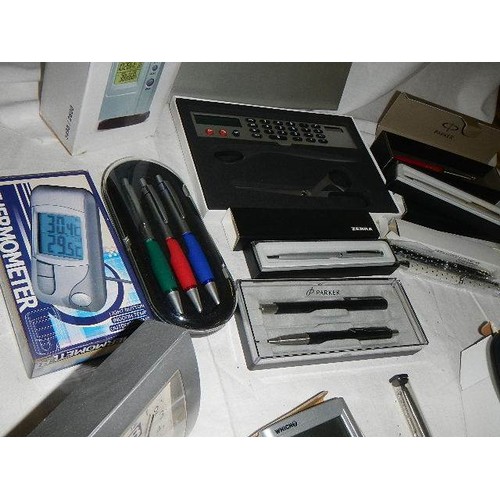 516 - A mixed lot including pen sets, clock etc.,