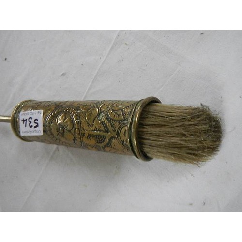 534 - An antique brass hearth brush.