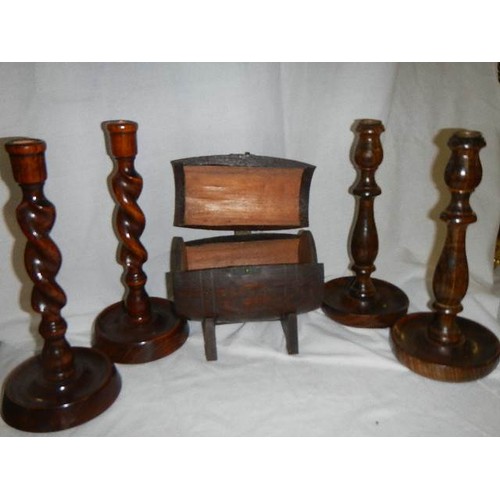 542 - Two pairs of wooden candlesticks and a barrel shaped box.