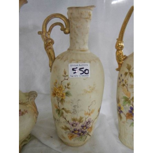 550 - Three Victorian china vases/ewers.