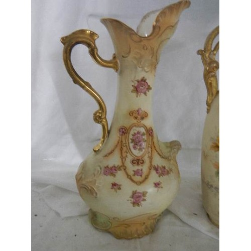 550 - Three Victorian china vases/ewers.