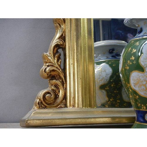 564 - A large gilt framed overmantel mirror.