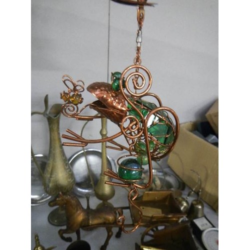 568 - A hanging brass and glass frog wind chime.