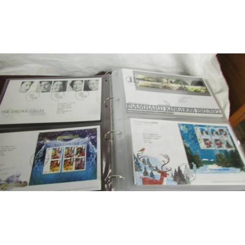 1225 - Two folders of first day covers.