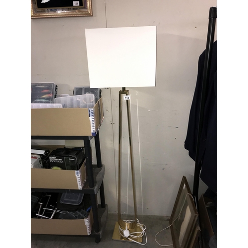 114 - An ornate brass floor standing standard lamp. Collect only