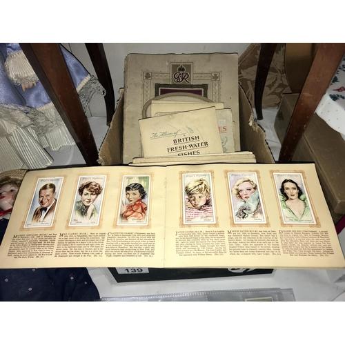 139 - A quantity of cigarette cards & books Circa 1930's