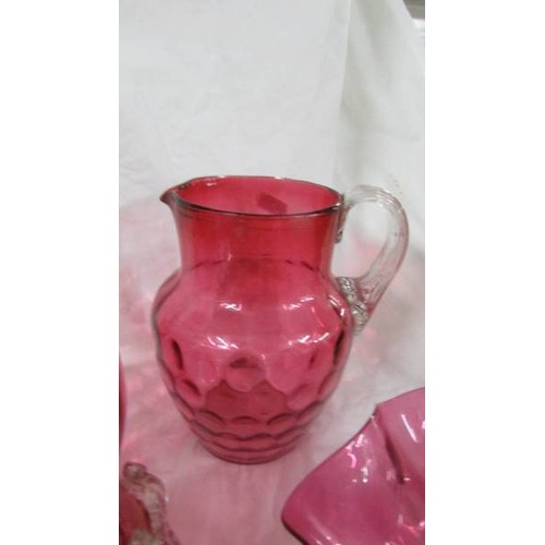 1306 - 6 pieces of cranberry glass including bowl, jug etc.,