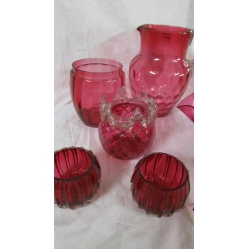 1306 - 6 pieces of cranberry glass including bowl, jug etc.,