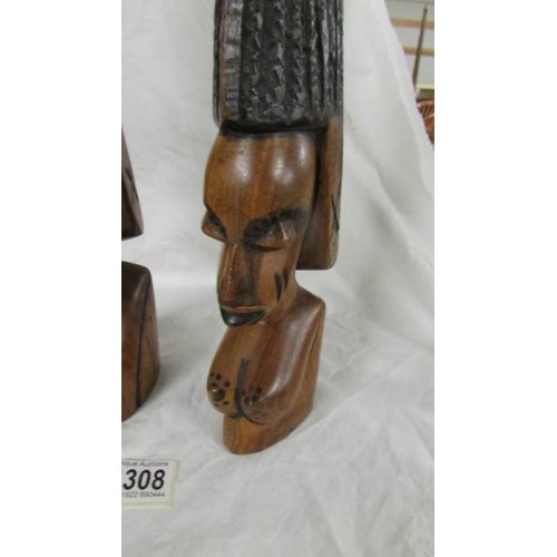 1308 - A pair of good quality carved hardwood tribal heads.