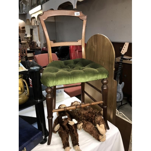 144 - An Edwardian mahogany bedroom chair with green Draylon and deep buttoned seat. Collect only