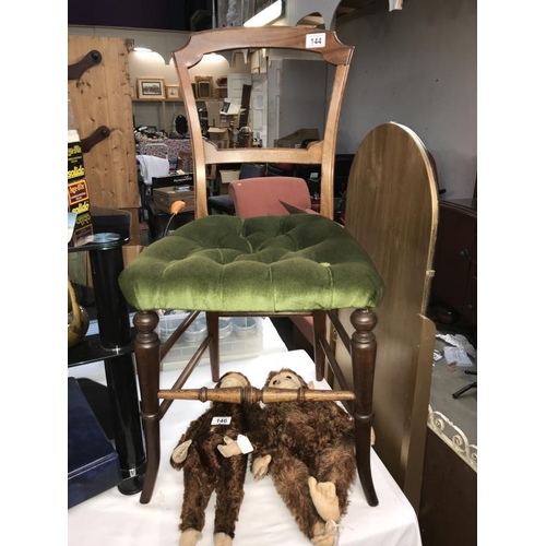 144 - An Edwardian mahogany bedroom chair with green Draylon and deep buttoned seat. Collect only