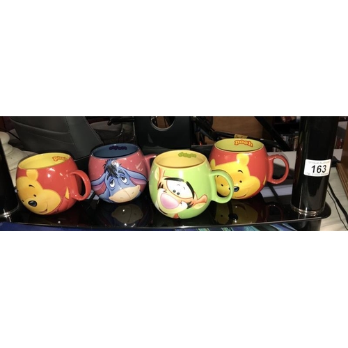 163 - 4 Disney Winnie The Pooh, Tigger, Eeyore & Patchwork mugs