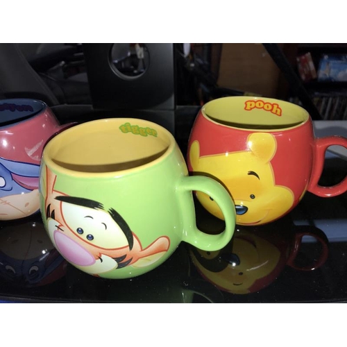 163 - 4 Disney Winnie The Pooh, Tigger, Eeyore & Patchwork mugs