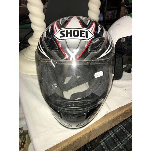 166 - 2 motorcycle helmets