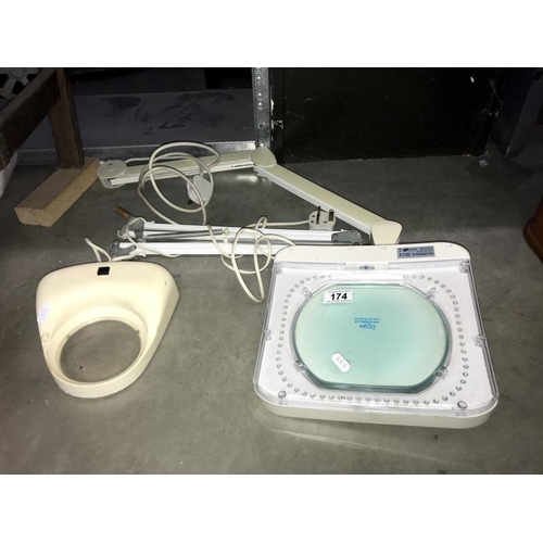 174 - An adjustable illuminated magnifier & 1 other (no stands)