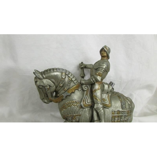 1253 - An Austrian spelter touch tip lighter of a Knight on horseback.