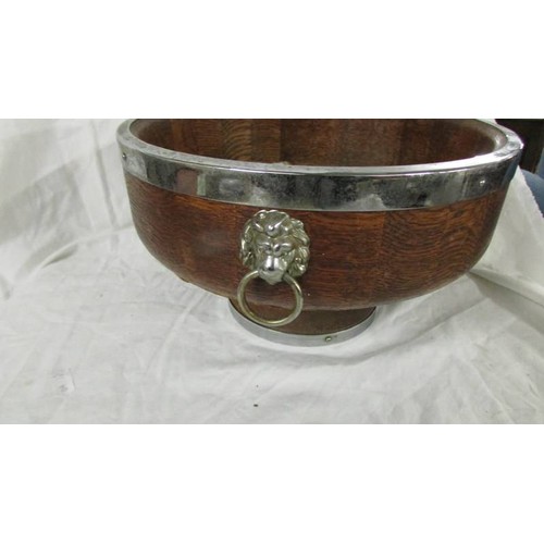 1349 - An oak fruit bowl with plated fittings.