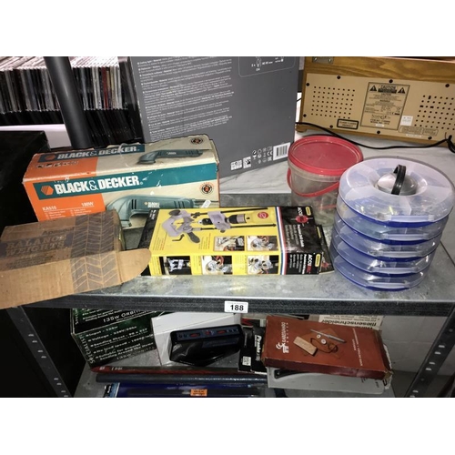 188 - A selection of miscellaneous tools including sanding sheets, clamps, tile collar, and metal shelves ... 