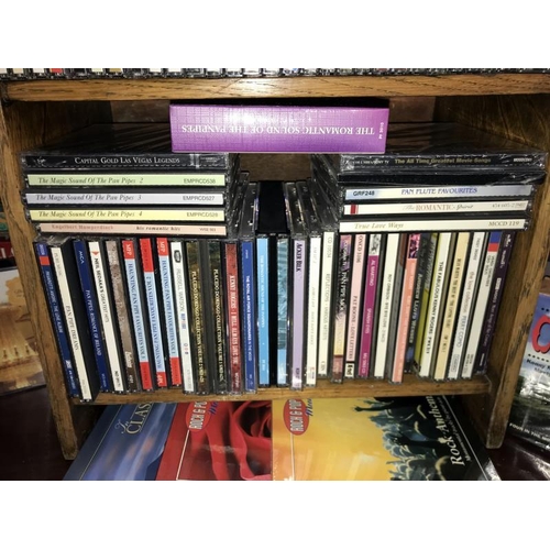 226 - A quantity of music CD's including Country, the 3 tenors etc. including CD storage case