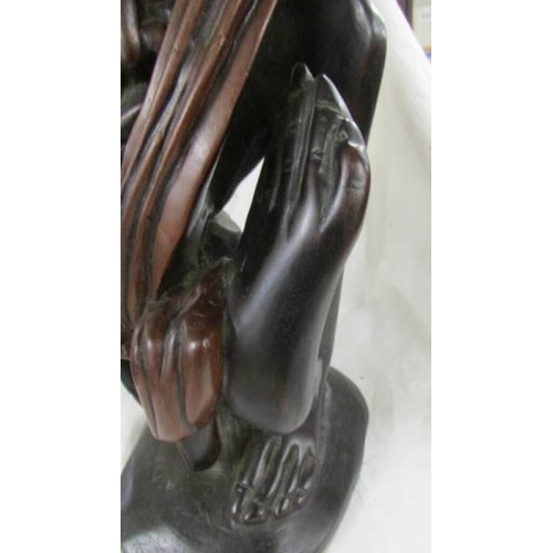 1395 - A good quality carved hardwood figure, 55 cm tall.