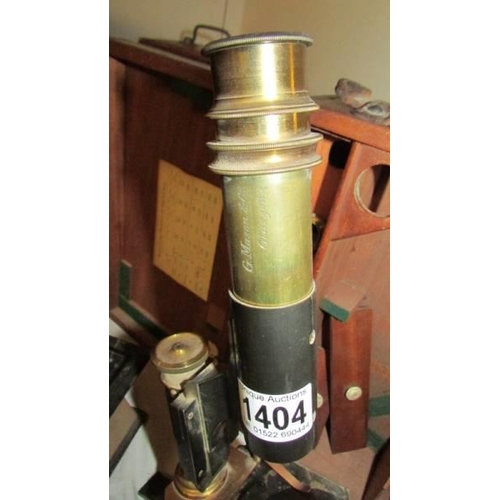 1404 - A cased brass and metal microscope marked G Mason & Co., Glasgow.