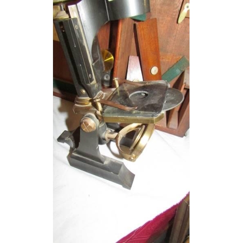 1404 - A cased brass and metal microscope marked G Mason & Co., Glasgow.