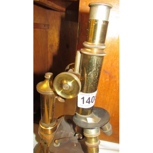 1408 - A cased brass microscope marked E Leitze Wetzlar, No. 49242.