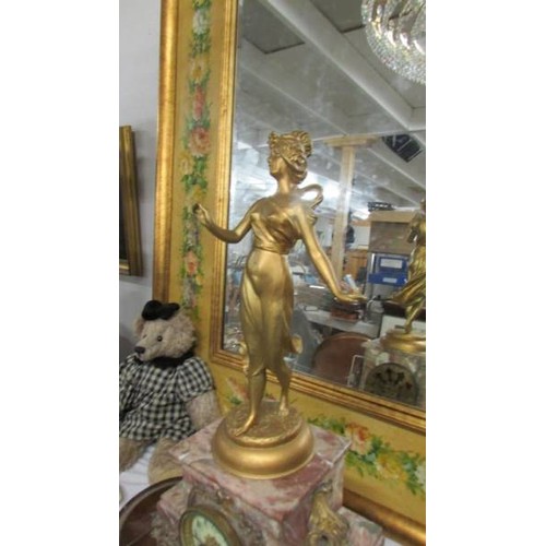 1426 - An early French marble and ormolu mantel clock surmounted figure. in working order.