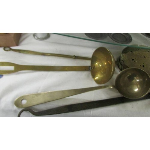 1456 - Two brass chestnut roasters and two brass ladles.