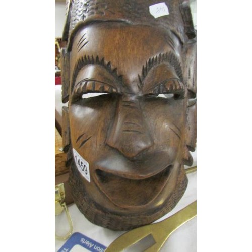 1459 - A carved wood wall mask.