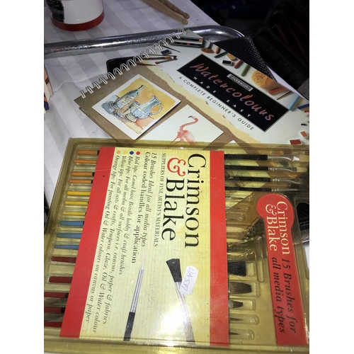 247 - A quantity of reference books on art & a packet of paint brushes etc.