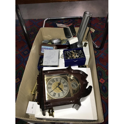 250 - A box of miscellaneous including wall clock, enamel eggs & torches etc.