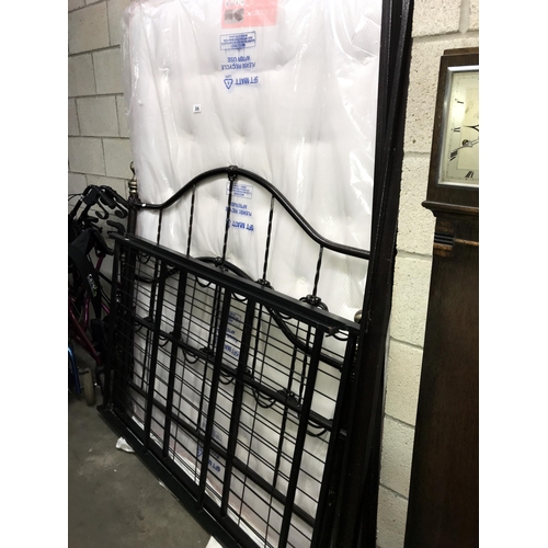 286 - A double framed metal bed with new mattress