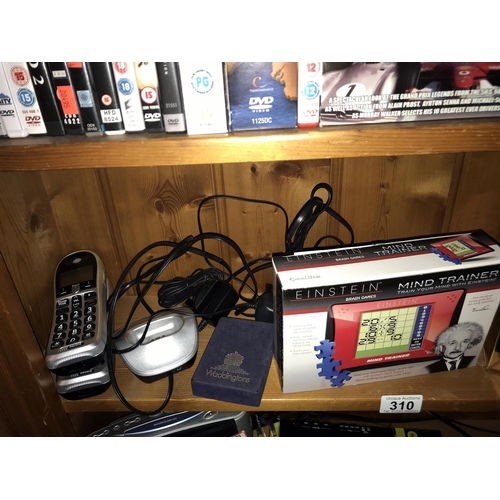 310 - A quantity of sundry electrical & electronic goods including phones, radio's & a massager etc. (3 sh... 