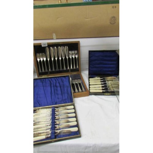 1502 - Three cased sets of fish knives and forks.