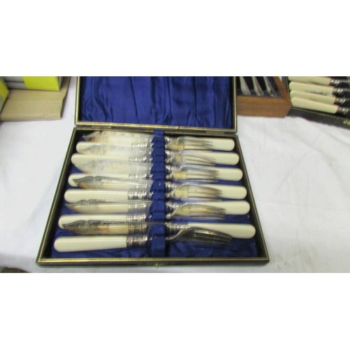 1502 - Three cased sets of fish knives and forks.