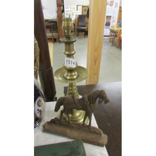 1514 - A brass lamp base and a cast iron horse door stop.