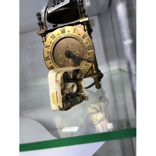 320 - A Smiths electric brass lantern clock