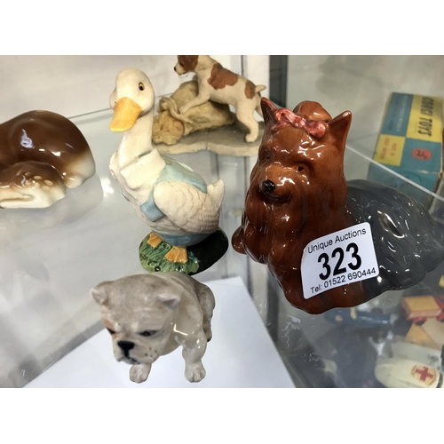 323 - A quantity of animal figures including Beswick