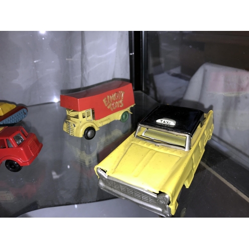 330 - A selection of tin plate and plastic friction toys, including Triang, tank, jeep, ambulance etc