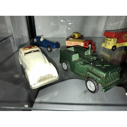 330 - A selection of tin plate and plastic friction toys, including Triang, tank, jeep, ambulance etc