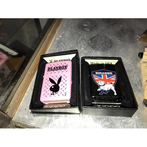 338 - 8 boxed Zippo lighters, inc Playboy, Copacabana, British Bulldog etc. (postage only to Mainland UK)