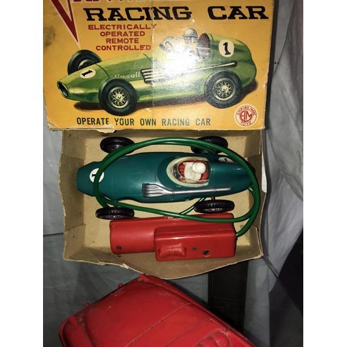 346 - A Marx fire chief car and a boxed Empire made Vanwall racing car, battery operated