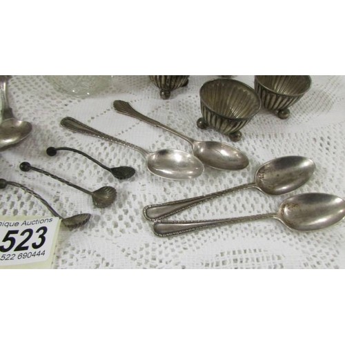 1523 - Three silver topped pots, four silver salts and a quantity of silver spoons.