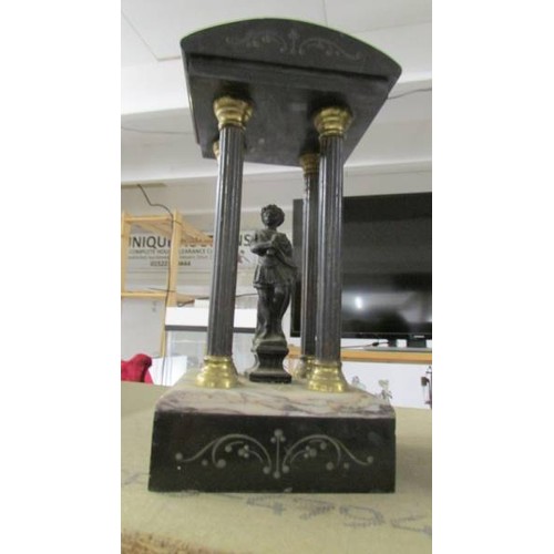 1526 - A Victorian black marble mantel clock with two Grecian style side pieces.