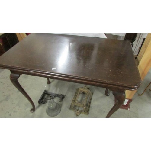 1536 - A mahogany fold over tea table on Queen Ann legs.