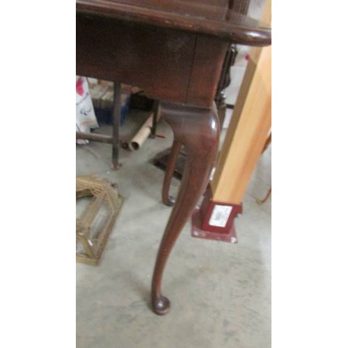 1536 - A mahogany fold over tea table on Queen Ann legs.